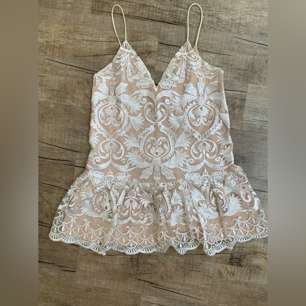 Lace minidress with nude slip underneath